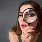 Woman with magnifying glass